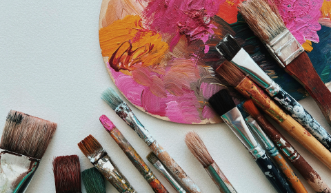 Paint brushes with paint on them 