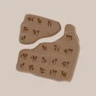 Broken stone tablet with hieroglyphics.