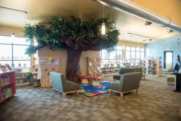 West Pasco library interior featuring large tree storytime area